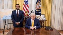 U.S President Donald Trump sitting to the right with the new FBI Director Kash Patel standing on the left at the Oval Office of the White House.