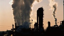 Industrial plant silhouette aginst a gray sky