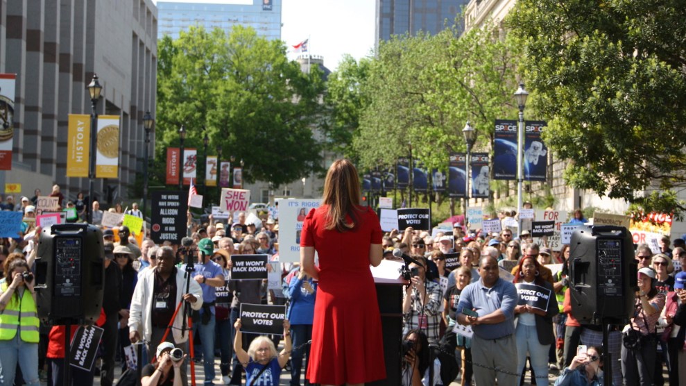 Democratic Associate Justice Allison Riggs stands before supporters at her rally in Raleigh, N.C., on April 14, 2025.